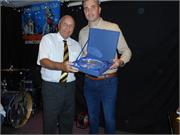 Chairman Sammy Haskins presenting David with a gift from Comber Rec